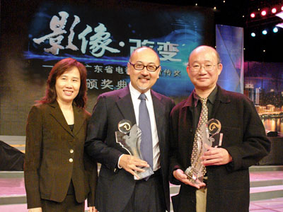 Dim Sum TV’s management celebrating the evening’s awards: Director and Chief Executive Officer, Mr. Kit Szeto (center), Executive Vice President & Chief Operation Officer, Mr. Giovanni Chan (right) and Corporate Communications Department Controller, Ms. Lynna Qi (left).