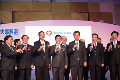 The guests raising a toast on stage