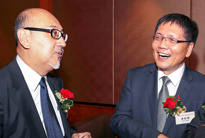 Mr. Kit Szeto speaking with Mr. Leung Ka Wing, Director of Broadcasting.