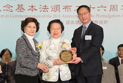 Mr Rimsky Yuen Kwok-keung, the Secretary for Justice presents a souvenir to Ms Maria Tam Wai-chu (middle), a Hong Kong deputy to the National People's Congress
