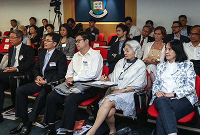 Audience invited to the forum are absorbed in the discussions.
